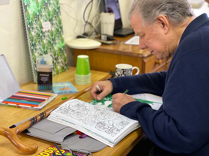 A man enjoying a painting activity